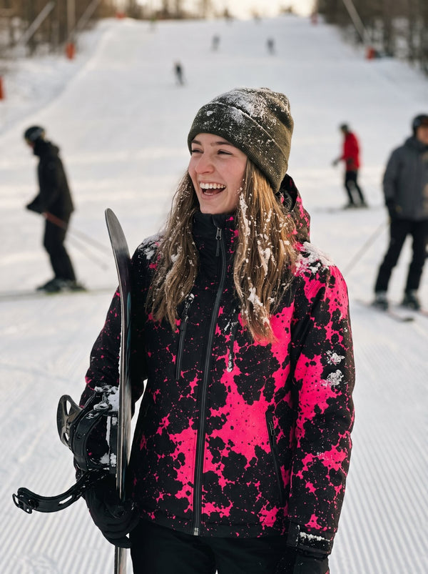 Snowboarder wearing the KRYO jacket in Flare Pink